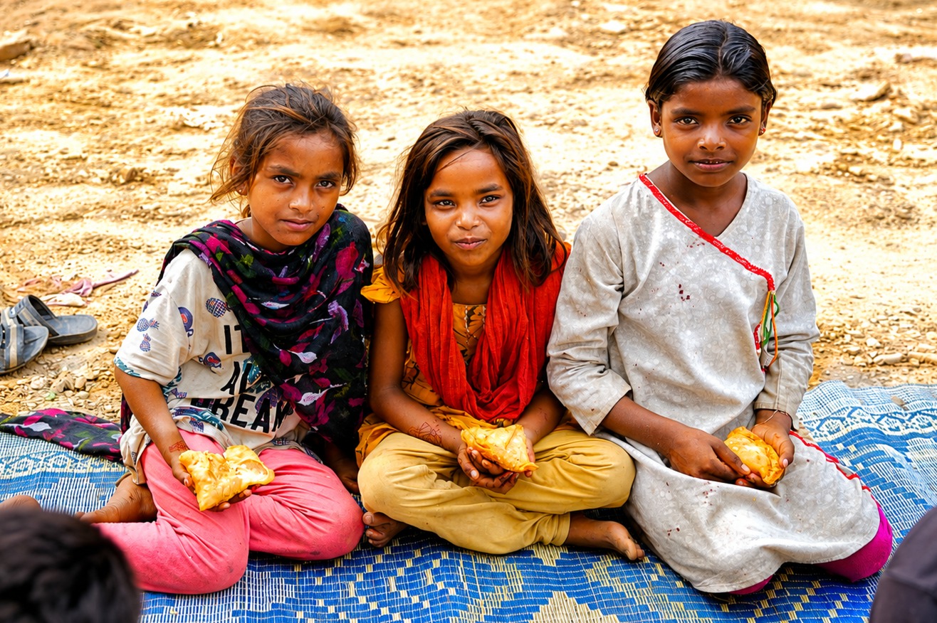 Young girls receiving food and care through Chopan Trust compassion programmes